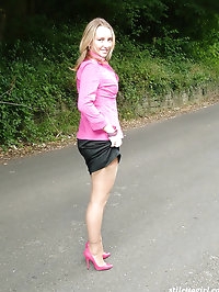 Blonde with an ankle tattoo showing of her pink high heels..