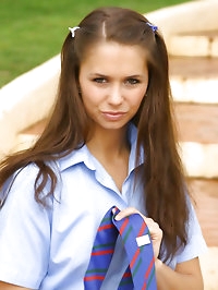 Cheeky brunette Louise in college uniform and stockings